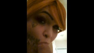 Tattooed Red Head Tranny Gives Daddy Some Head