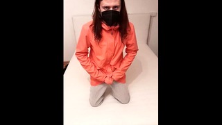 Sissy masturbates in pink raincoat