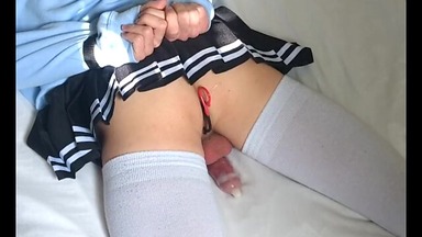 handcuffed crossdresser cums from anal into condom